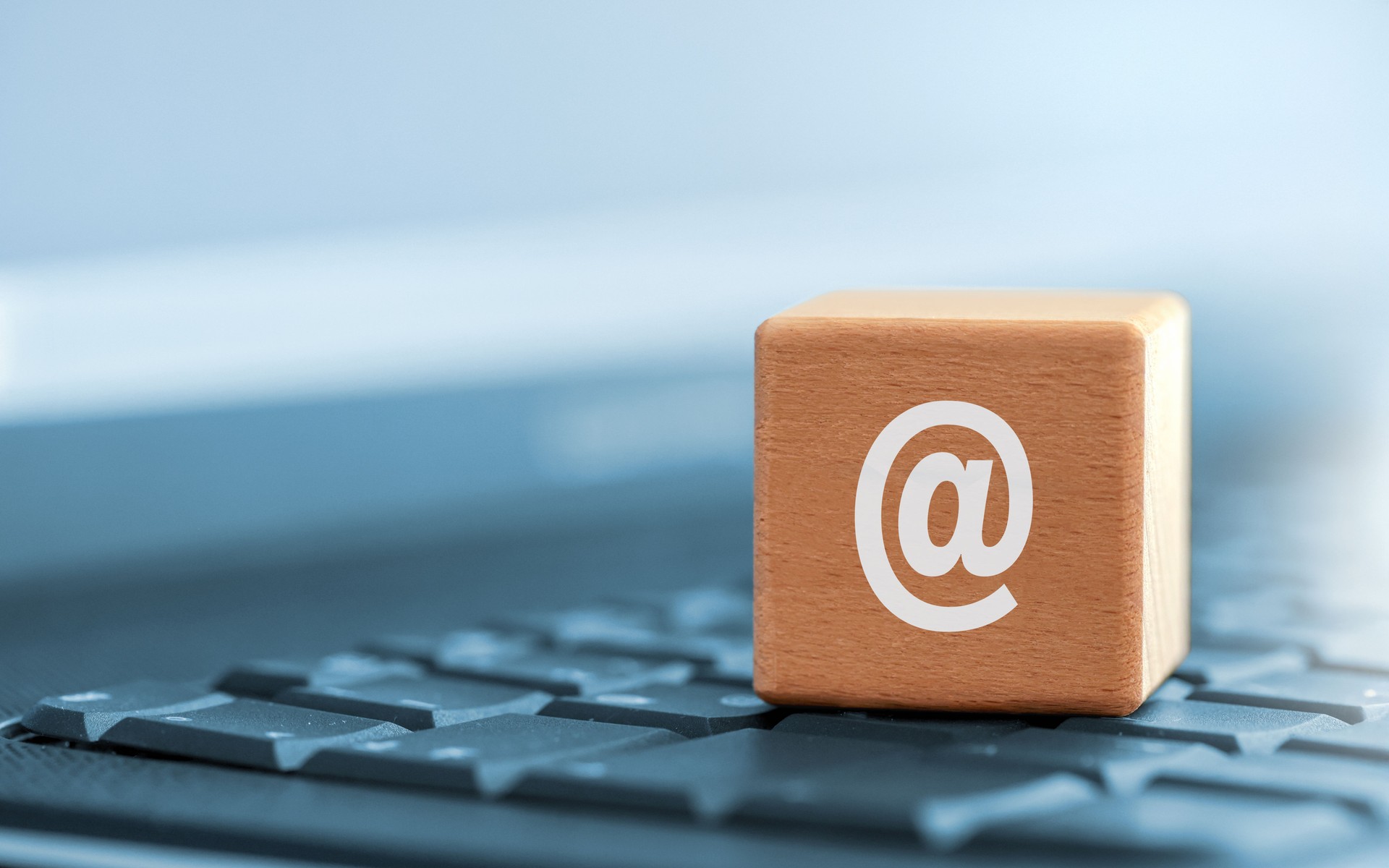 Dice with contact@bespokeaura.co.uk email on the keyboard